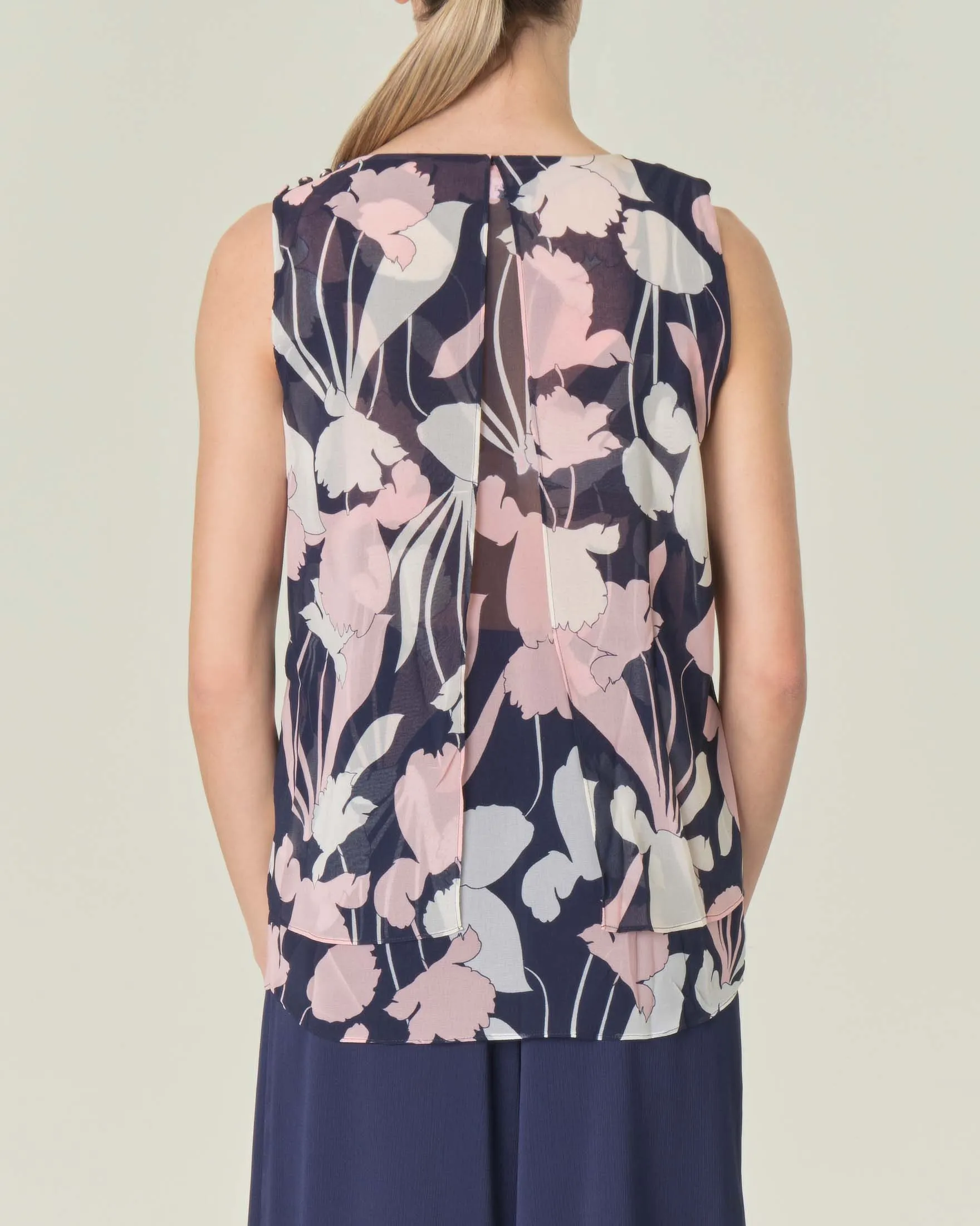 Blusa blu a fantasia fiori rosa e bianchi senza maniche in doppio tessuto